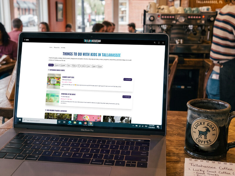 A laptop displaying Tallahasseean on a table at a Tallahassee coffee shop.